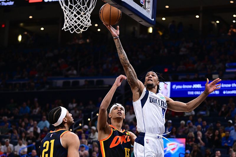 OKLAHOMA CITY, OKLAHOMA - APRIL 14: A.J. Lawson #9 of the Dallas Mavericks goes to the rim during the second half against the Oklahoma City Thunder at Paycom Center on April 14, 2024 in Oklahoma City, Oklahoma. NOTE TO USER: User expressly acknowledges and agrees that, by downloading and or using this Photograph, user is consenting to the terms and conditions of the Getty Images License Agreement. (Photo by Joshua Gateley/Getty Images)