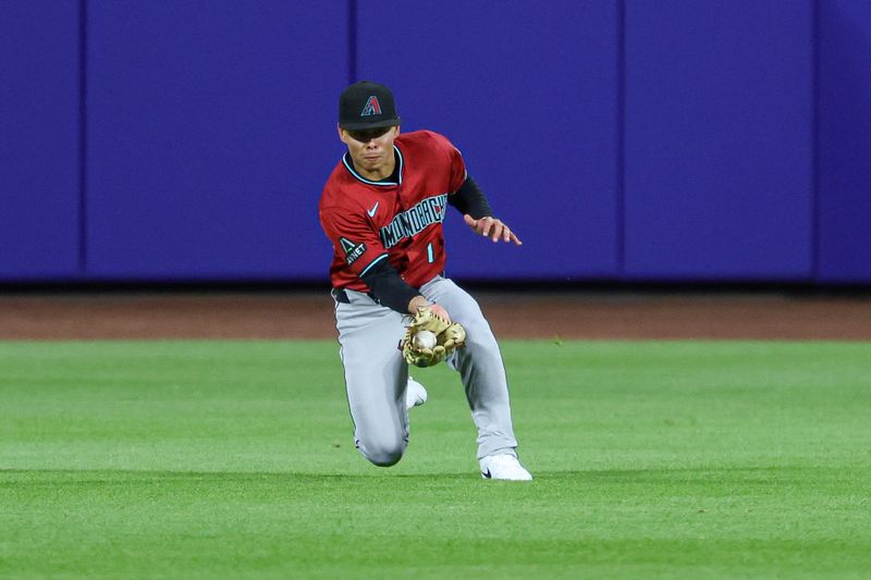 Apr 29, 2025; New York City, New York, USA; Arizona Diamondbacks right fielder Jorge Barrosa (1) makes a catch for an out during the third inning against the New York Mets at Citi Field. Mandatory Credit: Vincent Carchietta-Imagn Images