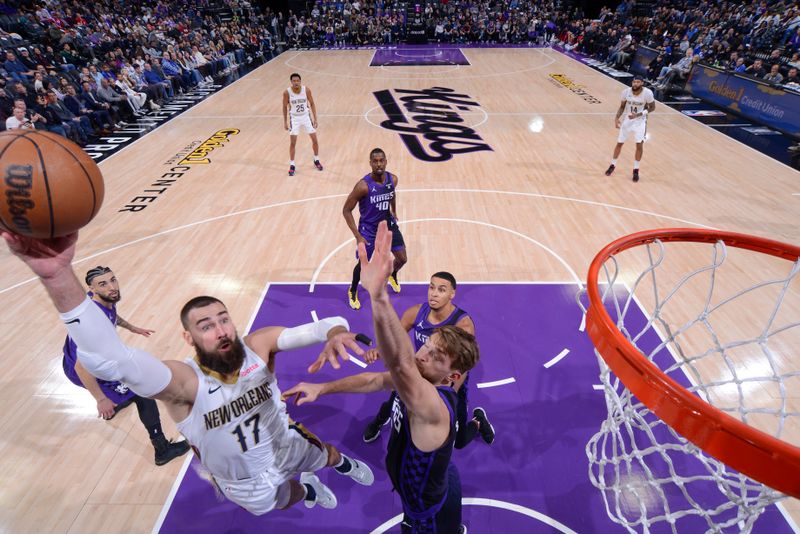 SACRAMENTO, CA - JANUARY 7:  Jonas Valanciunas #17 of the New Orleans Pelicans goes to the basket during the game on January 7, 2024 at Golden 1 Center in Sacramento, California. NOTE TO USER: User expressly acknowledges and agrees that, by downloading and or using this Photograph, user is consenting to the terms and conditions of the Getty Images License Agreement. Mandatory Copyright Notice: Copyright 2024 NBAE (Photo by Rocky Widner/NBAE via Getty Images)