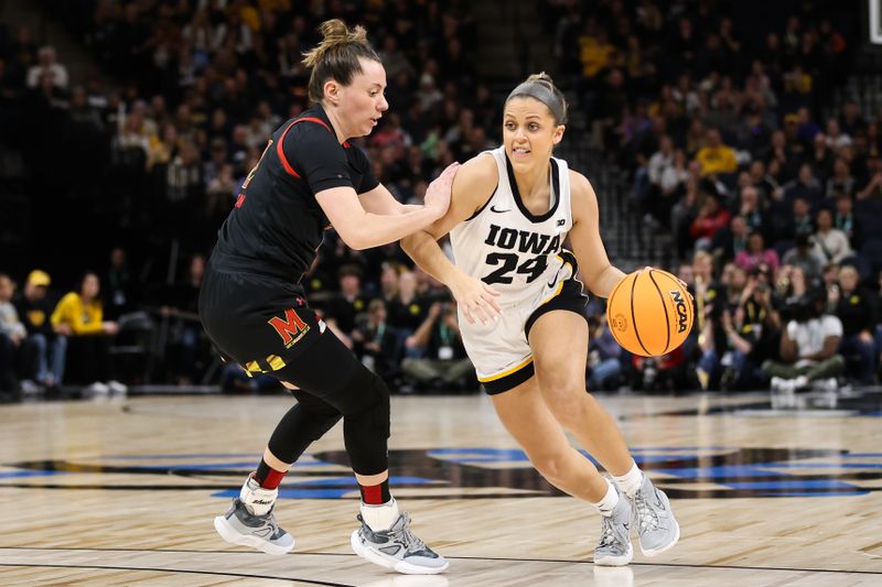 Mar 4, 2023; Minneapolis, MINN, USA; Iowa Hawkeyes guard Gabbie Marshall (24) dribbles while Maryland Terrapins guard Elisa Pinzan (12) defends during the first half at Target Center. Mandatory Credit: Matt Krohn-USA TODAY Sports