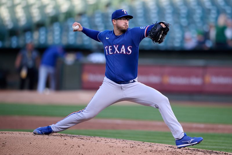 Aug 7, 2023; Oakland, California, USA; Texas Rangers starting pitcher Dane Dunning (33) throws a pitch against the Oakland Athletics during the second inning at Oakland-Alameda County Coliseum. Mandatory Credit: Robert Edwards-USA TODAY Sports