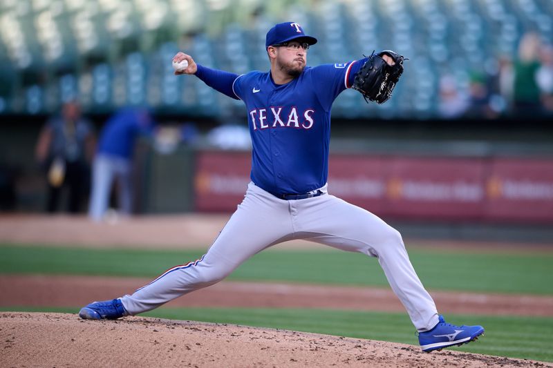 Aug 7, 2023; Oakland, California, USA; Texas Rangers starting pitcher Dane Dunning (33) throws a pitch against the Oakland Athletics during the second inning at Oakland-Alameda County Coliseum. Mandatory Credit: Robert Edwards-USA TODAY Sports