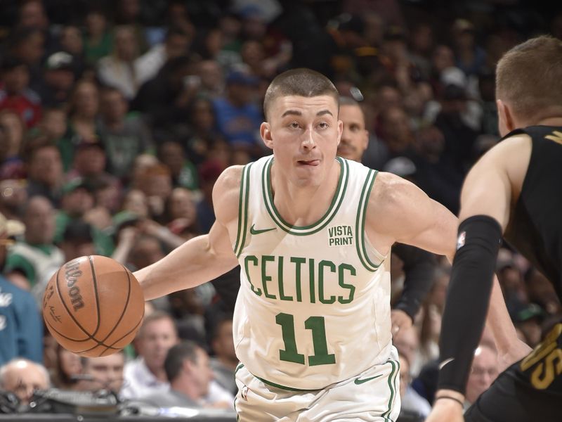 CLEVELAND, OH - MARCH 5: Payton Pritchard #11 of the Boston Celtics dribbles the ball during the game against the Cleveland Cavaliers on March 5, 2024 at Rocket Mortgage FieldHouse in Cleveland, Ohio. NOTE TO USER: User expressly acknowledges and agrees that, by downloading and/or using this Photograph, user is consenting to the terms and conditions of the Getty Images License Agreement. Mandatory Copyright Notice: Copyright 2024 NBAE (Photo by David Liam Kyle/NBAE via Getty Images)