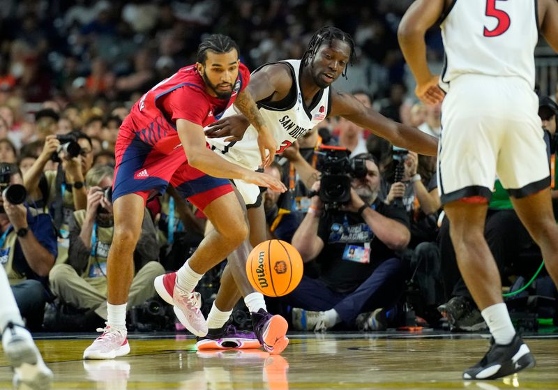 Apr 1, 2023; Houston, TX, USA; Florida Atlantic Owls guard Jalen Gaffney (12) chases the ball against San Diego State Aztecs forward Nathan Mensah (31) in the semifinals of the Final Four of the 2023 NCAA Tournament at NRG Stadium. Mandatory Credit: Robert Deutsch-USA TODAY Sports