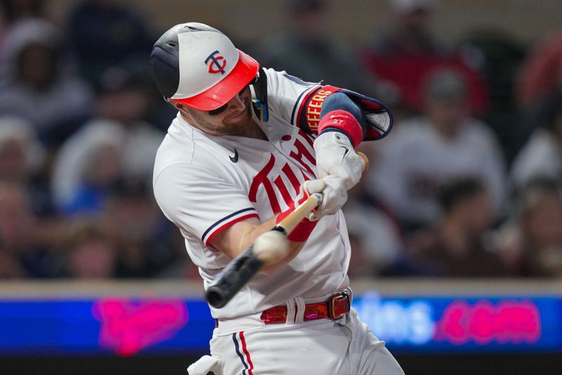 Sep 27, 2023; Minneapolis, Minnesota, USA; Minnesota Twins designated hitter Ryan Jeffers (27) hits a sacrifice fly against the Oakland Athletics in the eighth inning at Target Field. Mandatory Credit: Brad Rempel-USA TODAY Sports