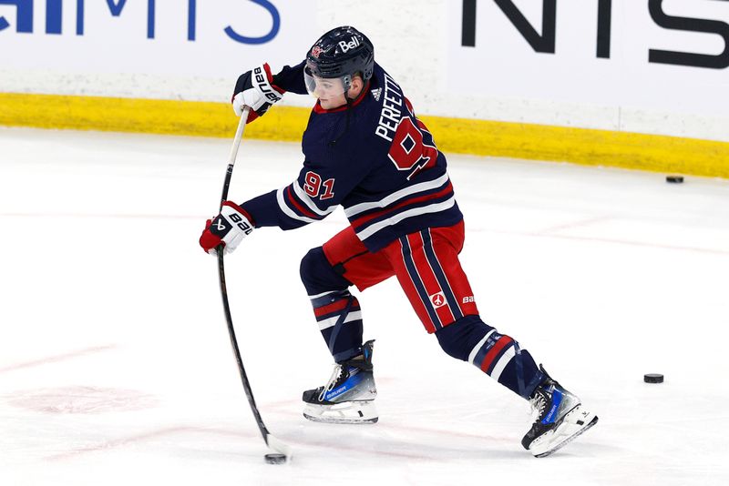 Mar 26, 2024; Winnipeg, Manitoba, CAN;  Winnipeg Jets center Cole Perfetti (91) warms up before a game against the Edmonton Oilers at Canada Life Centre. Mandatory Credit: James Carey Lauder-USA TODAY Sports