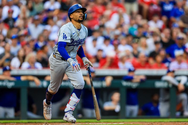 May 24, 2024; Cincinnati, Ohio, USA; Los Angeles Dodgers shortstop Mookie Betts (50) runs the bases after hitting a RBI double against the Cincinnati Reds in the second inning at Great American Ball Park. Mandatory Credit: Katie Stratman-USA TODAY Sports