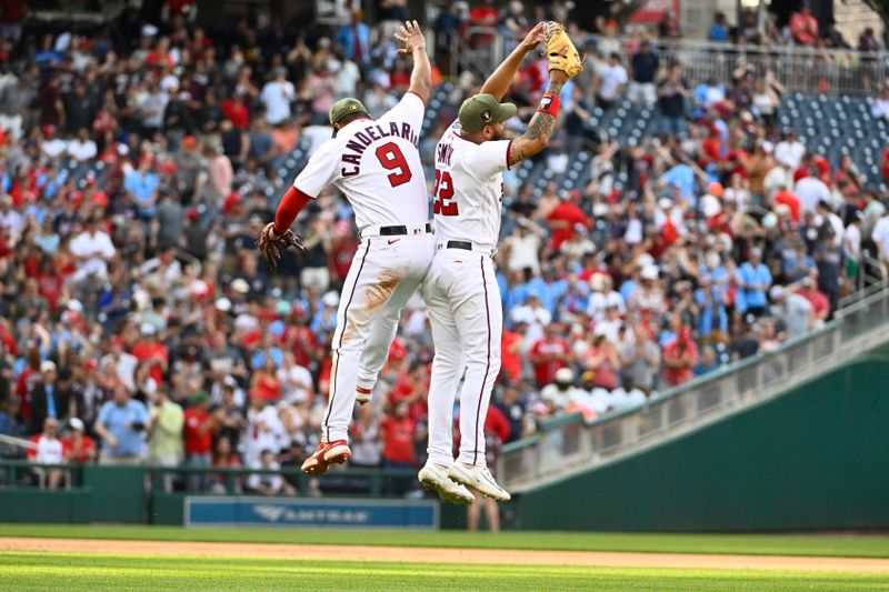 May 20, 2023; Washington, District of Columbia, USA; Washington Nationals third baseman Jeimer Candelario (9) and first baseman Dominic Smith (22) celebrate after the game against the Detroit Tigers at Nationals Park. Mandatory Credit: Brad Mills-USA TODAY Sports