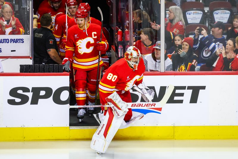 Oct 4, 2024; Calgary, Alberta, CAN; Calgary Flames goaltender Dan Vladar (80) takes the ice during the warmup period against the Winnipeg Jets at Scotiabank Saddledome. Mandatory Credit: Sergei Belski-Imagn Images