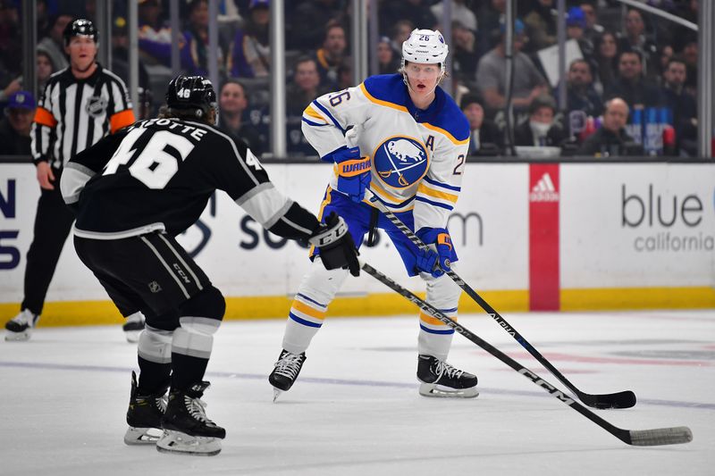 Feb 13, 2023; Los Angeles, California, USA; Buffalo Sabres defenseman Rasmus Dahlin (26) controls the puck against Los Angeles Kings center Blake Lizotte (46) during the first period at Crypto.com Arena. Mandatory Credit: Gary A. Vasquez-USA TODAY Sports