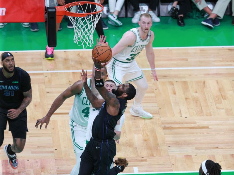 BOSTON, MA - JUNE 6: Kyrie Irving #11 of the Dallas Mavericks goes to the basket during the game against the Boston Celtics during Game 1 of the 2024 NBA Finals on June 6, 2024 at the TD Garden in Boston, Massachusetts. NOTE TO USER: User expressly acknowledges and agrees that, by downloading and or using this photograph, User is consenting to the terms and conditions of the Getty Images License Agreement. Mandatory Copyright Notice: Copyright 2024 NBAE  (Photo by Chris Marion/NBAE via Getty Images)