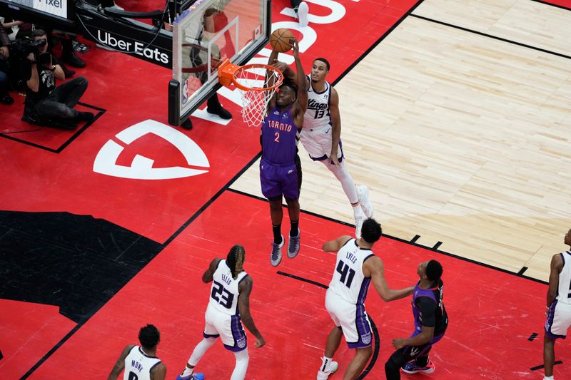 TORONTO, CANADA - NOVEMBER 2: Jonathan Mogbo #2 of the Toronto Raptors drives to the basket during the game against the Sacramento Kings on November 2, 2024 at the Scotiabank Arena in Toronto, Ontario, Canada.  NOTE TO USER: User expressly acknowledges and agrees that, by downloading and or using this Photograph, user is consenting to the terms and conditions of the Getty Images License Agreement.  Mandatory Copyright Notice: Copyright 2024 NBAE (Photo by Andrew Lahodynskyj/NBAE via Getty Images)