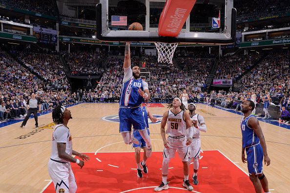 SACRAMENTO, CA - DECEMBER 2: JaVale McGee #00 of the Sacramento Kings dunks the ball during the game against the Denver Nuggets on December 2, 2023 at Golden 1 Center in Sacramento, California. NOTE TO USER: User expressly acknowledges and agrees that, by downloading and or using this Photograph, user is consenting to the terms and conditions of the Getty Images License Agreement. Mandatory Copyright Notice: Copyright 2023 NBAE (Photo by Rocky Widner/NBAE via Getty Images)