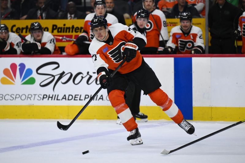 Nov 2, 2024; Philadelphia, Pennsylvania, USA; Philadelphia Flyers defenseman Erik Johnson (77) passes the puck against the Boston Bruins in the second period at Wells Fargo Center. Mandatory Credit: Kyle Ross-Imagn Images