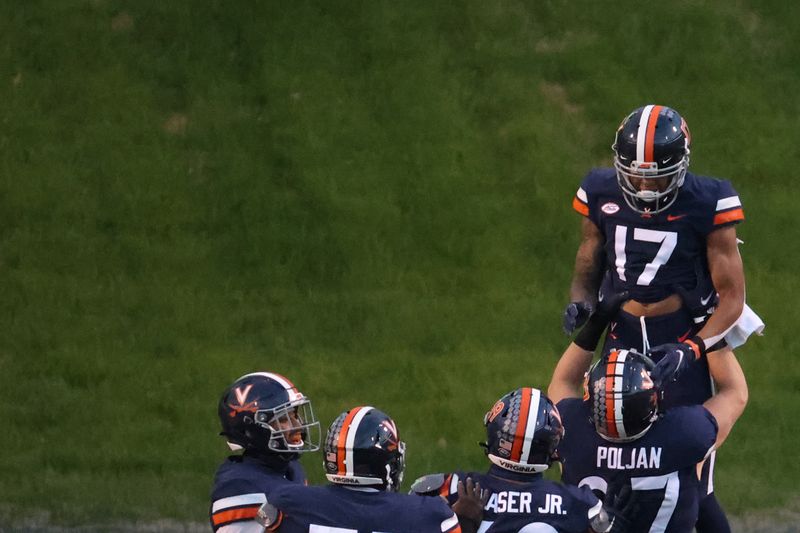 Dec 5, 2020; Charlottesville, Virginia, USA; Virginia Cavaliers wide receiver Ra'Shaun Henry (17) celebrates with Cavaliers tight end Tony Poljan (87) after scoring a touchdown against the Boston College Eagles in the second quarter at Scott Stadium. Mandatory Credit: Geoff Burke-USA TODAY Sports