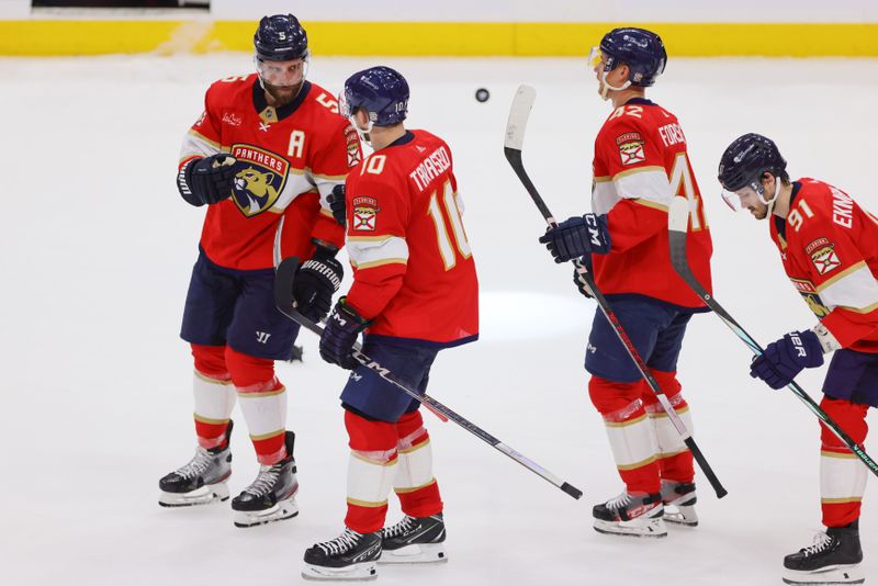 Apr 21, 2024; Sunrise, Florida, USA; Florida Panthers defenseman Aaron Ekblad (5) celebrates with right wing Vladimir Tarasenko (10) after defeating the Tampa Bay Lightning in game one of the first round of the 2024 Stanley Cup Playoffs at Amerant Bank Arena. Mandatory Credit: Sam Navarro-USA TODAY Sports