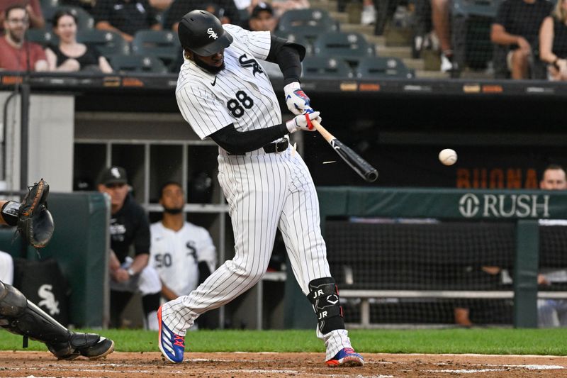 Jul 12, 2024; Chicago, Illinois, USA;  Chicago White Sox outfielder Luis Robert Jr. (88) hits an RBI single against the Pittsburgh Pirates during the third inning at Guaranteed Rate Field. Mandatory Credit: Matt Marton-USA TODAY Sports