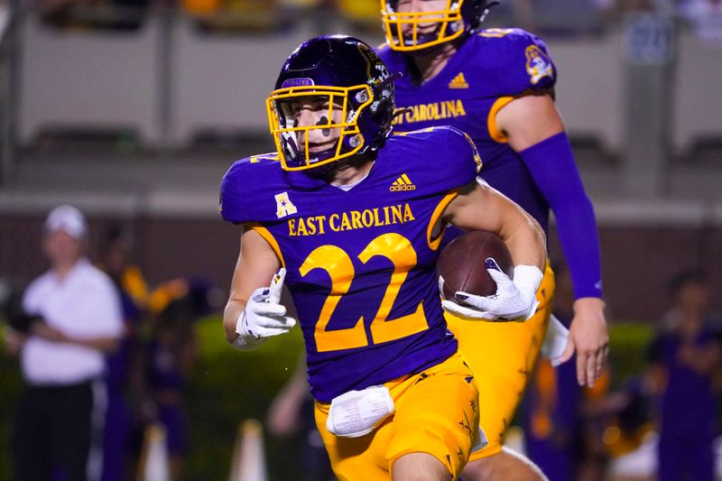 Sep 25, 2021; Greenville, North Carolina, USA;  East Carolina Pirates wide receiver Tyler Snead (22) runs with the ball against the Charleston Southern Buccaneers during the second half at Dowdy-Ficklen Stadium. Mandatory Credit: James Guillory-USA TODAY Sports