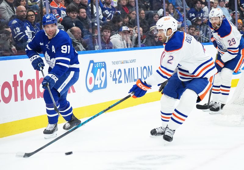 Dec 13, 2025; Toronto, Ontario, CAN; Toronto Maple Leafs center John Tavares (91) battles for the puck behind the net with Edmonton Oilers defenseman Evan Bouchard (2) during the first period at Scotiabank Arena. Mandatory Credit: Nick Turchiaro-Imagn Images