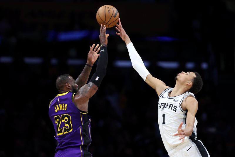 LOS ANGELES, CALIFORNIA - FEBRUARY 23: Victor Wembanyama #1 of the San Antonio Spurs blocks a shot by LeBron James #23 of the Los Angeles Lakers during the second half of a game at Crypto.com Arena on February 23, 2024 in Los Angeles, California. (Photo by Sean M. Haffey/Getty Images)