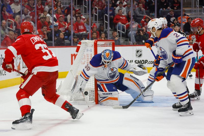 Oct 27, 2024; Detroit, Michigan, USA; Edmonton Oilers goaltender Calvin Pickard (30) makes a save during the second period of the game against the Detroit Red Wings at Little Caesars Arena. Mandatory Credit: Brian Bradshaw Sevald-Imagn Images