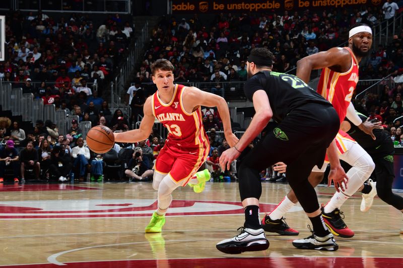 ATLANTA, GA - MARCH 10: Bogdan Bogdanovic #13 of the Atlanta Hawks dribbles the ball during the game against the New Orleans Pelicans on March 10, 2024 at State Farm Arena in Atlanta, Georgia.  NOTE TO USER: User expressly acknowledges and agrees that, by downloading and/or using this Photograph, user is consenting to the terms and conditions of the Getty Images License Agreement. Mandatory Copyright Notice: Copyright 2024 NBAE (Photo by Scott Cunningham/NBAE via Getty Images)