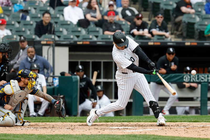 May 1, 2025; Chicago, Illinois, USA; Chicago White Sox third baseman Miguel Vargas (20) hits a three-run home run against the Milwaukee Brewers during the sixth inning at Rate Field. Mandatory Credit: Kamil Krzaczynski-Imagn Images