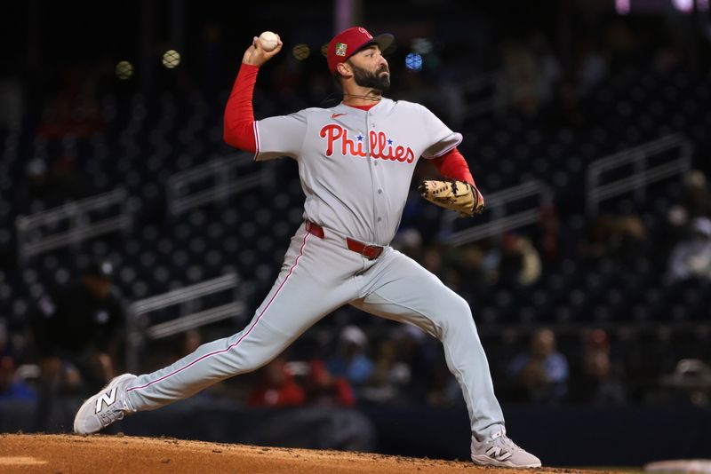 Feb 22, 2026; West Palm Beach, Florida, USA; Philadelphia Phillies relief pitcher Lou Trivino (22) delivers a pitch against the Washington Nationals during the third inning at CACTI Park of the Palm Beaches. Mandatory Credit: Sam Navarro-Imagn Images