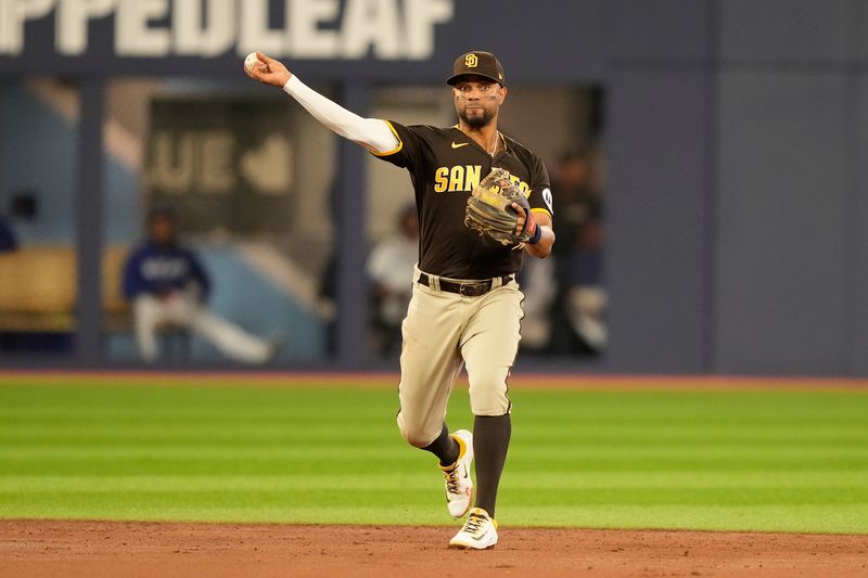 Jul 19, 2023; Toronto, Ontario, CAN; San Diego Padres shortstop Xander Bogaerts (2) throws out Toronto Blue Jays catcher Danny Jansen (not pictured) during the second inning at Rogers Centre. Mandatory Credit: John E. Sokolowski-USA TODAY Sports