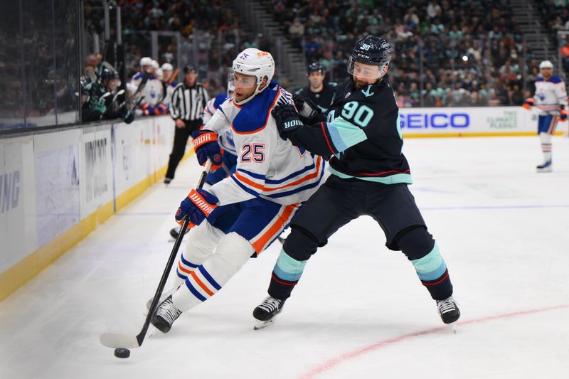 Mar 2, 2024; Seattle, Washington, USA; Edmonton Oilers defenseman Darnell Nurse (25) plays the puck while defended by Seattle Kraken left wing Tomas Tatar (90) during the second period at Climate Pledge Arena. Mandatory Credit: Steven Bisig-USA TODAY Sports