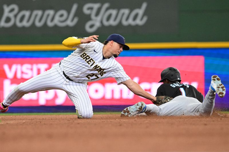 Jul 28, 2024; Milwaukee, Wisconsin, USA;  Milwaukee Brewers shortstop Willy Adames (27) tags out Miami Marlins center fielder Nick Gordon (1) trying to steal in the in the fourth inning at American Family Field. Mandatory Credit: Benny Sieu-USA TODAY Sports