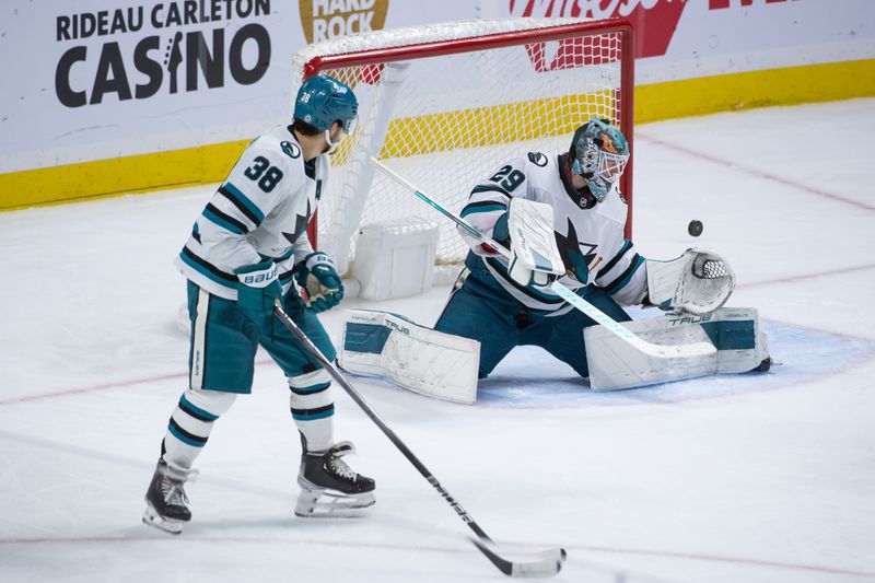 Jan 13, 2024; Ottawa, Ontario, CAN; San Jose Sharks goalie Mackenzie Blackwood (29) makes a save in the third period against the Ottawa Senators at the Canadian Tire Centre. Mandatory Credit: Marc DesRosiers-USA TODAY Sports