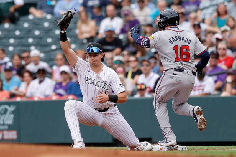 Aug 11, 2024; Denver, Colorado, USA; Atlanta Braves catcher Travis d'Arnaud (16) is thrown out at first against Colorado Rockies first baseman Michael Toglia (4) in the second inning at Coors Field. Mandatory Credit: Isaiah J. Downing-USA TODAY Sports