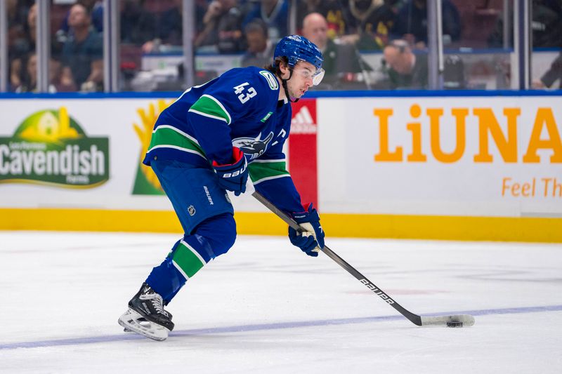 Apr 21, 2024; Vancouver, British Columbia, CAN; Vancouver Canucks defenseman Quinn Hughes (43) handles the puck against the Nashville Predators in the first period in game one of the first round of the 2024 Stanley Cup Playoffs at Rogers Arena. Mandatory Credit: Bob Frid-USA TODAY Sports