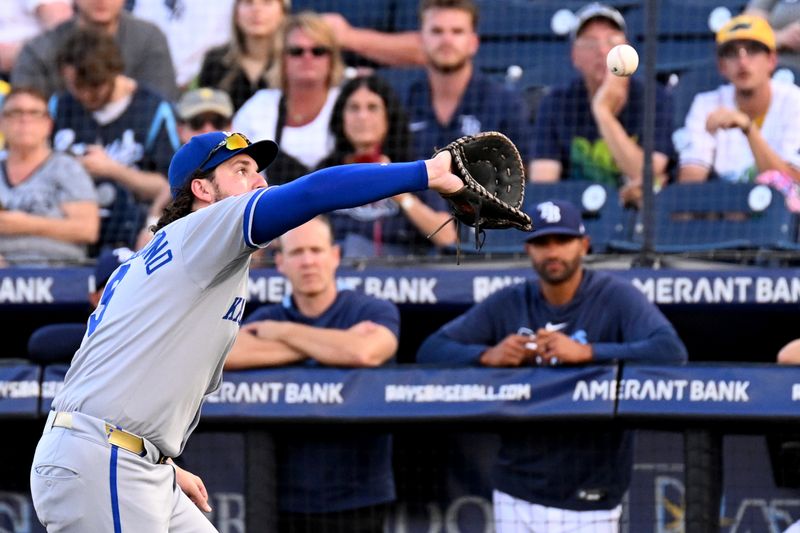 Apr 30, 2025; St. Petersburg, Florida, USA; Kansas City Royals first baseman Vinnie Pasquantino (9) catches a fly ball in the first inning against the Tampa Bay Rays at George M. Steinbrenner Field. Mandatory Credit: Jonathan Dyer-Imagn Images