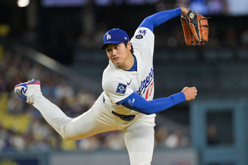 Sep 16, 2025; Los Angeles, California, USA; Los Angeles Dodgers designated hitter Shohei Ohtani (17) delivers a pitch during the first inning against the Philadelphia Phillies at Dodger Stadium. Mandatory Credit: Jayne Kamin-Oncea-Imagn Images