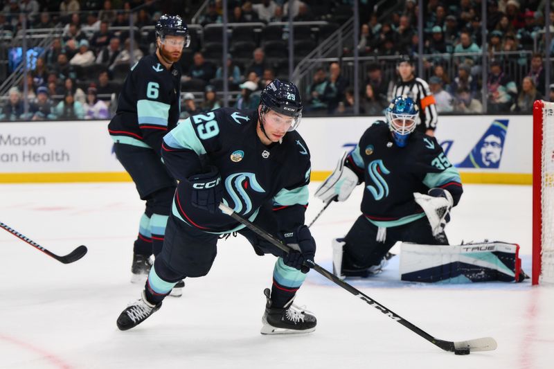 Dec 10, 2023; Seattle, Washington, USA; Seattle Kraken defenseman Vince Dunn (29) plays the puck during the third period against the Minnesota Wild at Climate Pledge Arena. Mandatory Credit: Steven Bisig-USA TODAY Sports