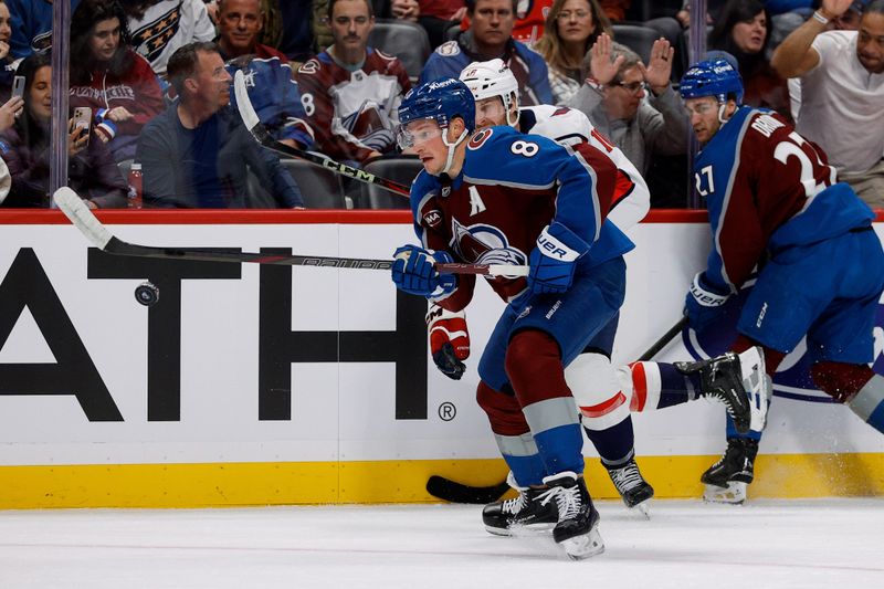 Nov 15, 2024; Denver, Colorado, USA; Colorado Avalanche defenseman Cale Makar (8) watches the puck ahead of Washington Capitals right wing Taylor Raddysh (16) in the first period at Ball Arena. Mandatory Credit: Isaiah J. Downing-Imagn Images