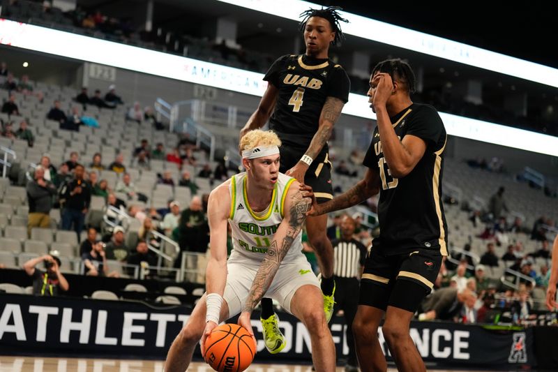 Mar 16, 2024; Fort Worth, TX, USA;  South Florida Bulls forward Kasean Pryor (11) controls the ball against UAB Blazers forward Christian Coleman (13) during the first half at Dickies Arena. Mandatory Credit: Chris Jones-USA TODAY Sports