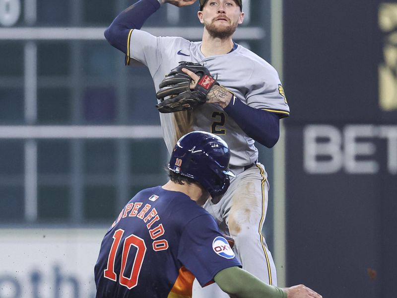 May 19, 2024; Houston, Texas, USA; Houston Astros left fielder Joey Loperfido (10) is out at second base as Milwaukee Brewers second baseman Brice Turang (2) throws to first base during the fourth inning at Minute Maid Park. Mandatory Credit: Troy Taormina-USA TODAY Sports