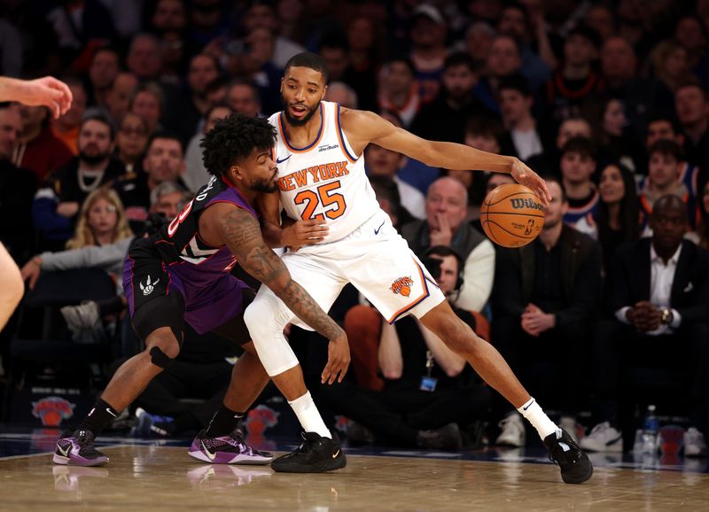 NEW YORK, NEW YORK - JANUARY 08:  Mikal Bridges #25 of the New York Knicks dribbles against Jamal Shead #23 of the Toronto Raptors during their game at Madison Square Garden on January 08, 2025 in New York City.   User expressly acknowledges and agrees that, by downloading and or using this photograph, User is consenting to the terms and conditions of the Getty Images License Agreement.  (Photo by Al Bello/Getty Images)