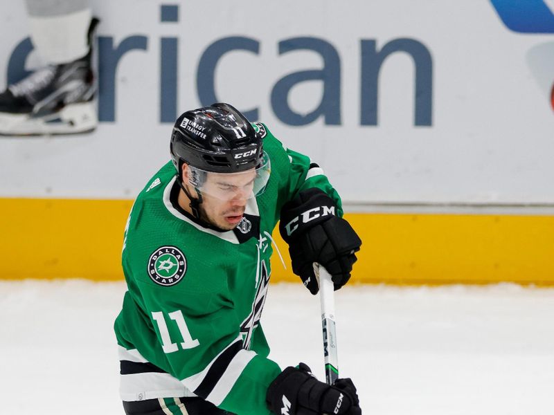 Mar 16, 2024; Dallas, Texas, USA; Dallas Stars center Logan Stankoven (11) flips the puck into the zone during the second period against the Los Angeles Kings at American Airlines Center. Mandatory Credit: Andrew Dieb-USA TODAY Sports