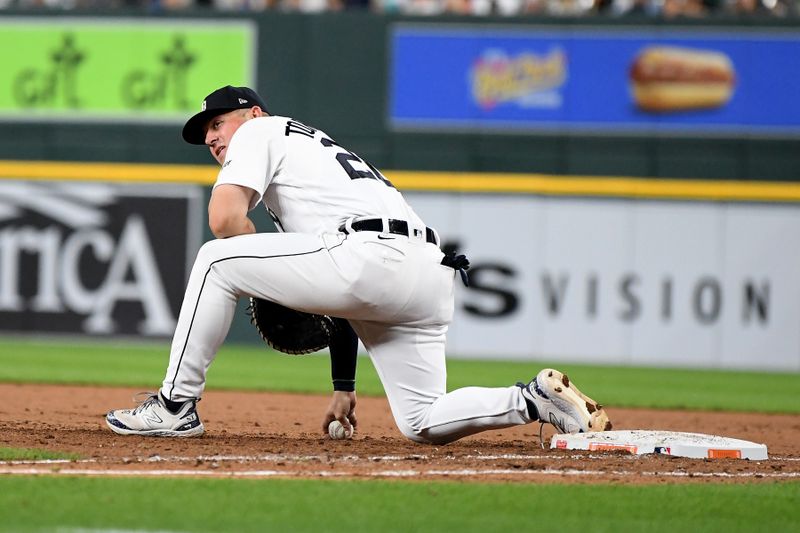 Aug 21, 2023; Detroit, Michigan, USA; Detroit Tigers first baseman Spencer Torkelson (20) reacts after dropping the ball on a throw to first against the Chicago Cubs in the eighth inning at Comerica Park. Mandatory Credit: Lon Horwedel-USA TODAY Sports