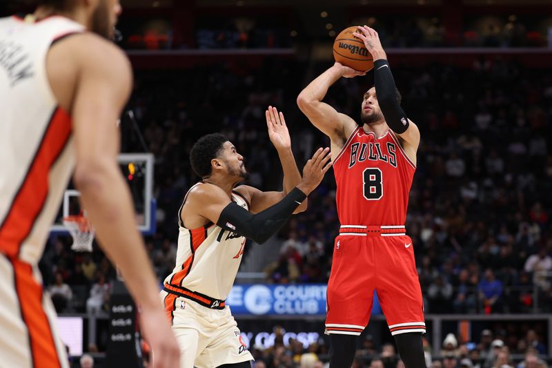 DETROIT, MICHIGAN - NOVEMBER 18: Zach LaVine #8 of the Chicago Bulls takes a second half three point shot next to Tobias Harris #12 of the Detroit Pistons at Little Caesars Arena on November 18, 2024 in Detroit, Michigan. Chicago won the game 122-112. NOTE TO USER: User expressly acknowledges and agrees that, by downloading and or using this photograph, User is consenting to the terms and conditions of the Getty Images License. (Photo by Gregory Shamus/Getty Images)