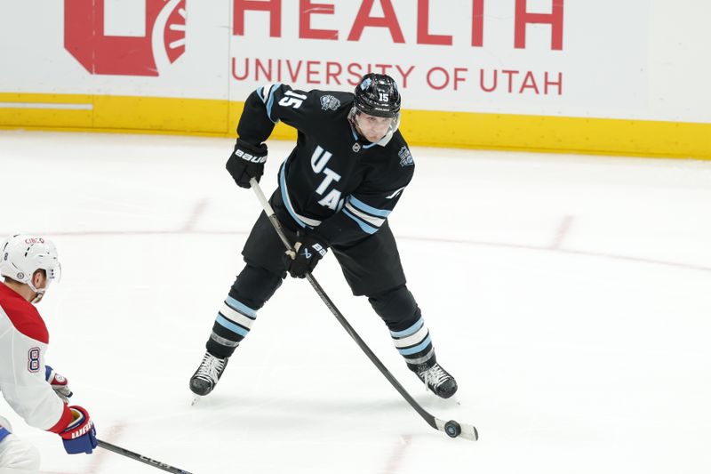 Jan 14, 2025; Salt Lake City, Utah, USA;  Utah Hockey Club center Alexander Kerfoot (15) shoots the puck past Montreal Canadiens defenseman Mike Matheson (8) during the second period at Delta Center. Mandatory Credit: Chris Nicoll-Imagn Images