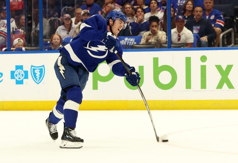 Mar 14, 2024; Tampa, Florida, USA; Tampa Bay Lightning defenseman Haydn Fleury (7) shoots against the New York Rangers during the first period at Amalie Arena. Mandatory Credit: Kim Klement Neitzel-USA TODAY Sports