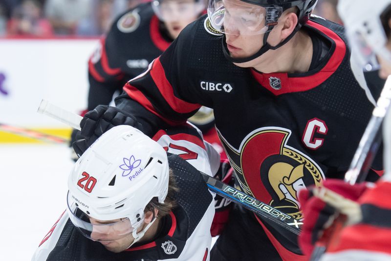 Dec 29, 2023; Ottawa, Ontario, CAN; New Jersey Devils center Michael McLeod (20) faces off against Ottawa Senators left wing Brady Tkachuk (7) in the first period at the Canadian Tire Centre. Mandatory Credit: Marc DesRosiers-USA TODAY Sports