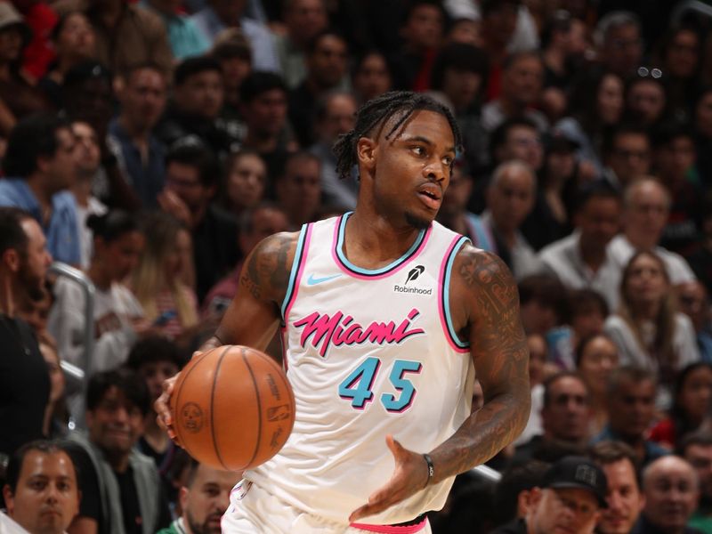 MIAMI, FL - FEBRUARY 10:  Davion Mitchell #45 of the Miami Heat dribbles the ball during the game against the Boston Celtics on February 10, 2025 at Kaseya Center in Miami, Florida. NOTE TO USER: User expressly acknowledges and agrees that, by downloading and or using this Photograph, user is consenting to the terms and conditions of the Getty Images License Agreement. Mandatory Copyright Notice: Copyright 2025 NBAE (Photo by Issac Baldizon/NBAE via Getty Images)