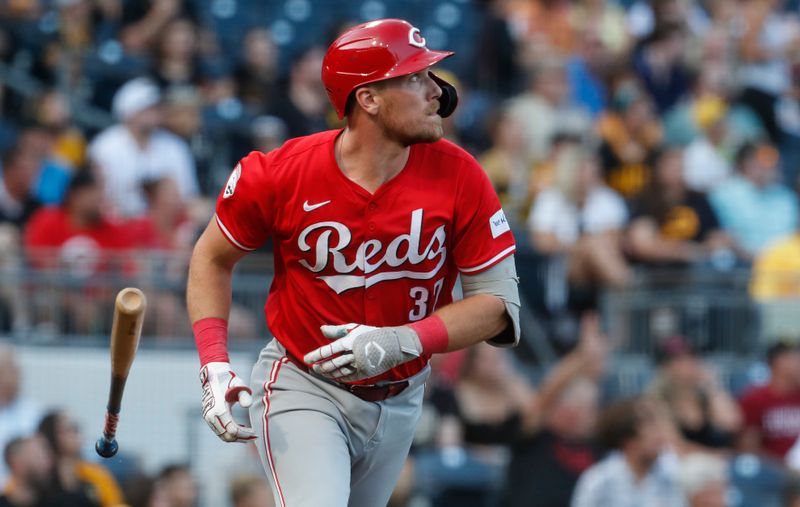 Aug 23, 2024; Pittsburgh, Pennsylvania, USA;  Cincinnati Reds catcher Tyler Stephenson (37) watches his solo home run against the Pittsburgh Pirates during the first inning at PNC Park. Mandatory Credit: Charles LeClaire-USA TODAY Sports