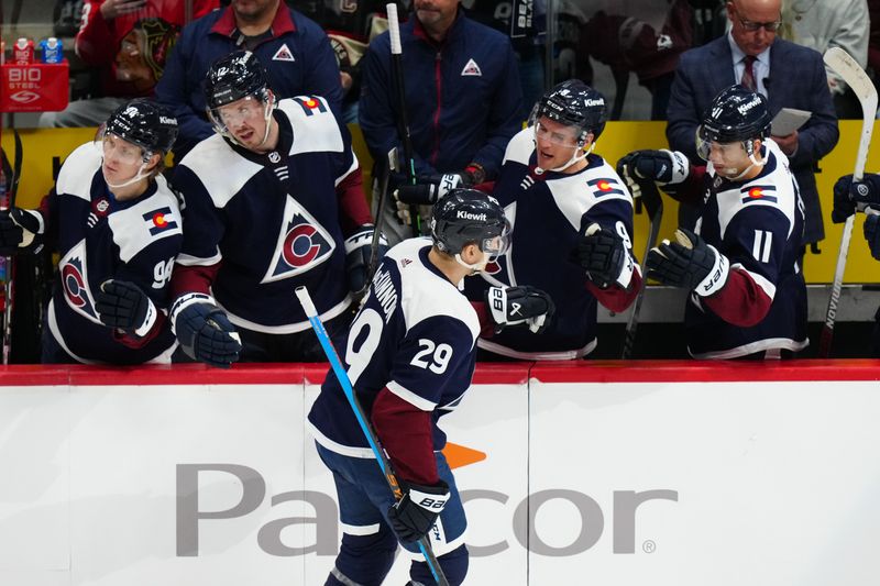 Mar 4, 2024; Denver, Colorado, USA; Colorado Avalanche center Nathan MacKinnon (29) celebrates his his goal with teammates in the first period against the Chicago Blackhawks at Ball Arena. Mandatory Credit: Ron Chenoy-USA TODAY Sports